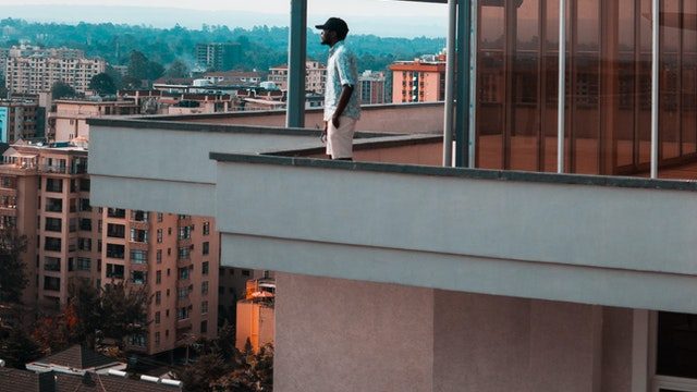 man-standing-at-balcony